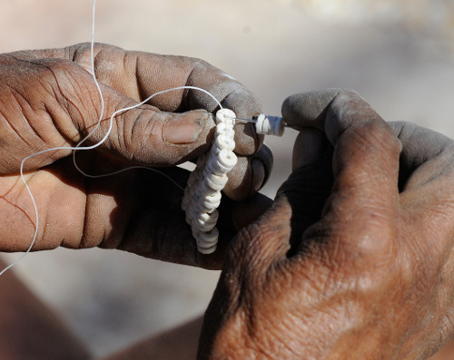 
		  Jewellery with an ostrich egg, ostrich eggshell, bushmen tradition 

